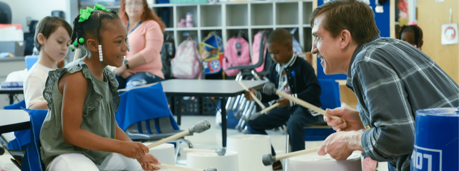 Teaching Artist Steven Cyphers leads a bucket drumming class with students at Prince Street Elementary in Wicomico County.